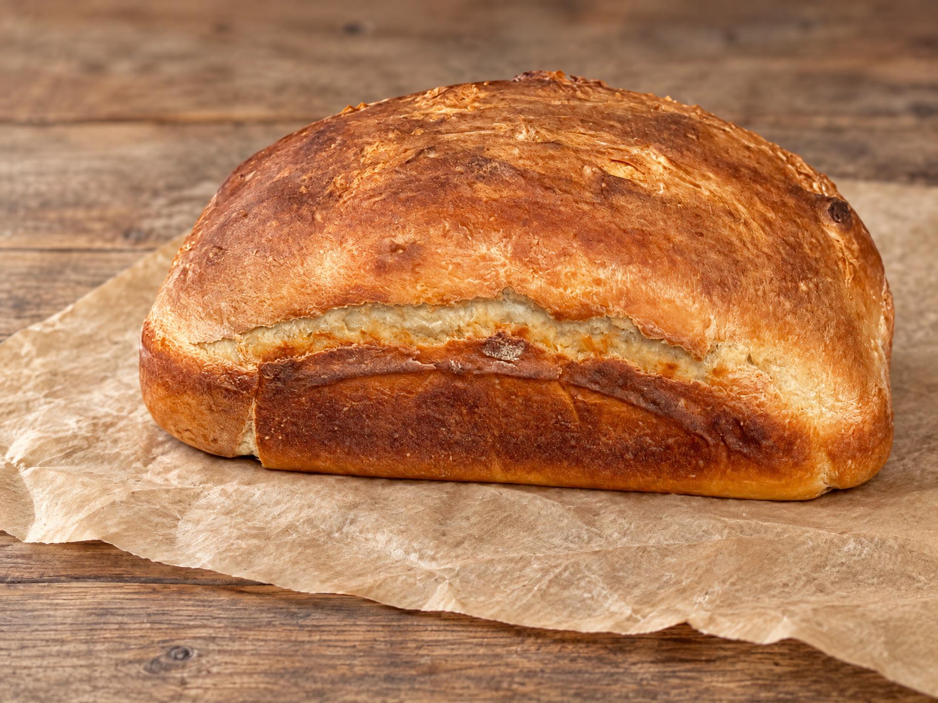 Tall domed sourdough loaf fresh from the oven
